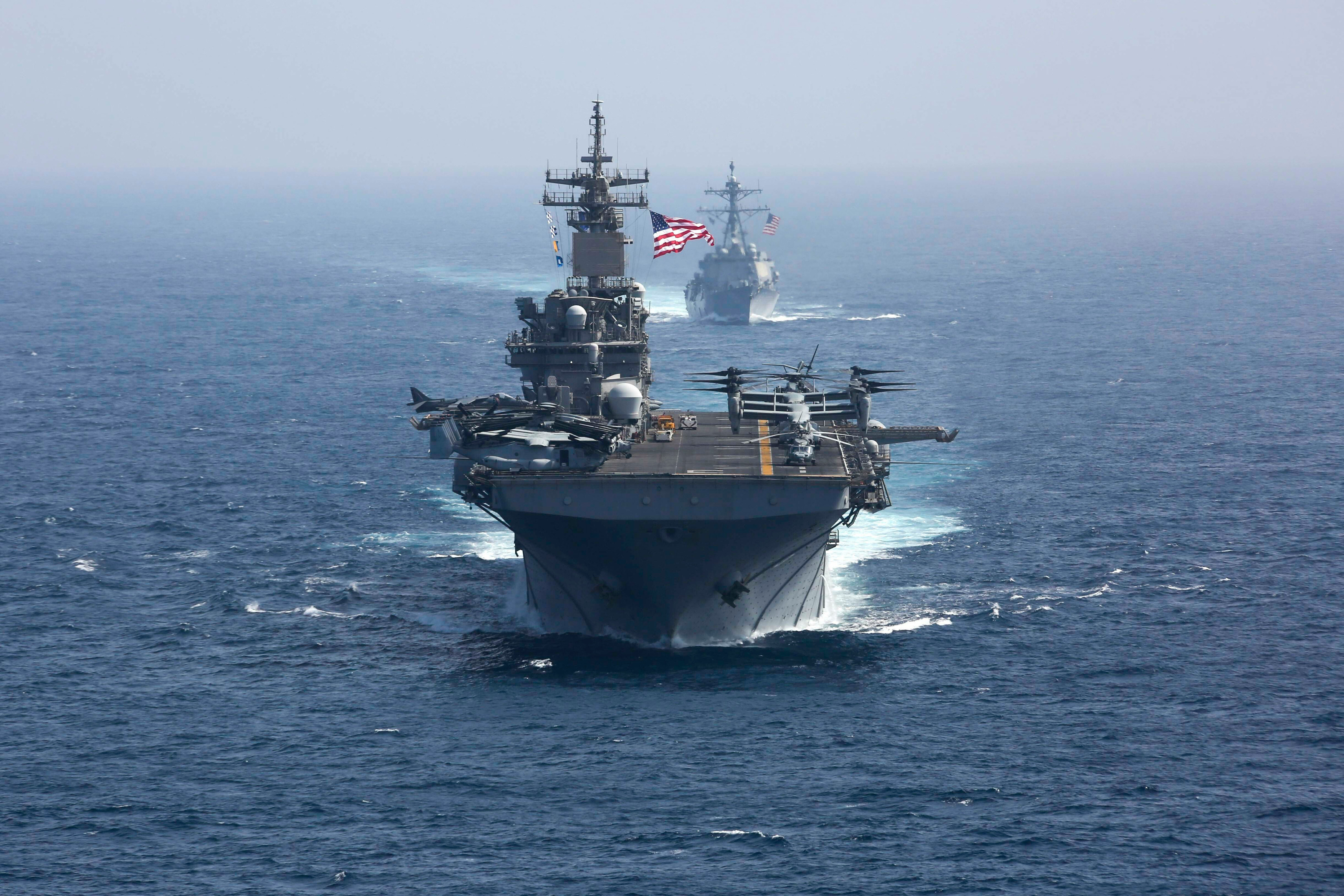  The amphibious assault ship USS Kearsarge (front) and the Arleigh Burke-class guided-missile destroyer USS Bainbridge