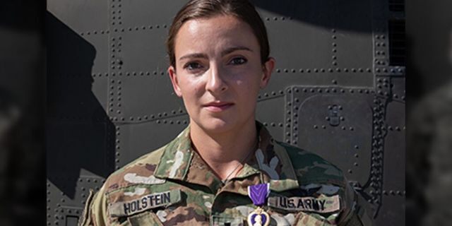 1st Lt. Abigail Holstein was presented the Purple Heart on May 3, 2020, for her injuries sustained during the theater ballistic missile attacks at Al Asad Air Base, Iraq, on January 8, 2020. Of the 27 Soldiers to receive Purple Hearts from the January attacks, 1st Lt. Holstein is one of the few 34th Expeditionary Combat Aviation Brigade recipients to return to duty after receiving initial treatment for her injuries and thus, received the Purple Heart medal in-theater. She serves as an enroute critical care nurse with Charlie Company, 3-238th General Support Aviation Battalion. (U.S. Army photo by Sgt. Sydney Mariette)